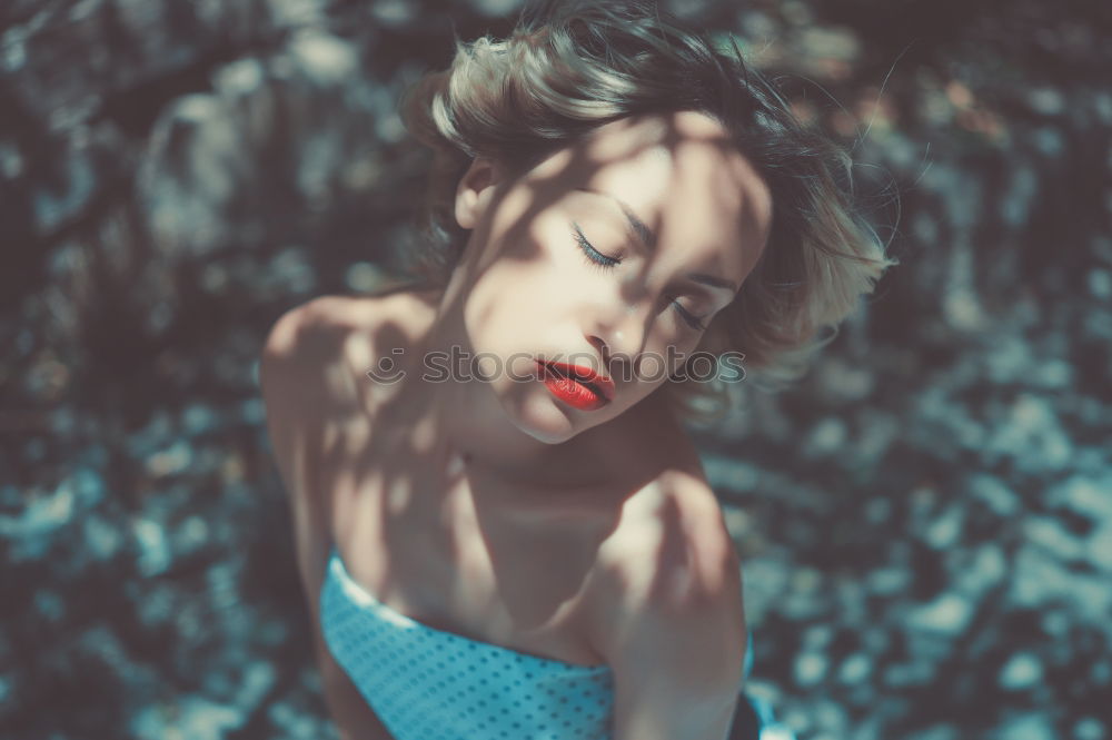 Similar – Cheerful brunette woman lying in grass