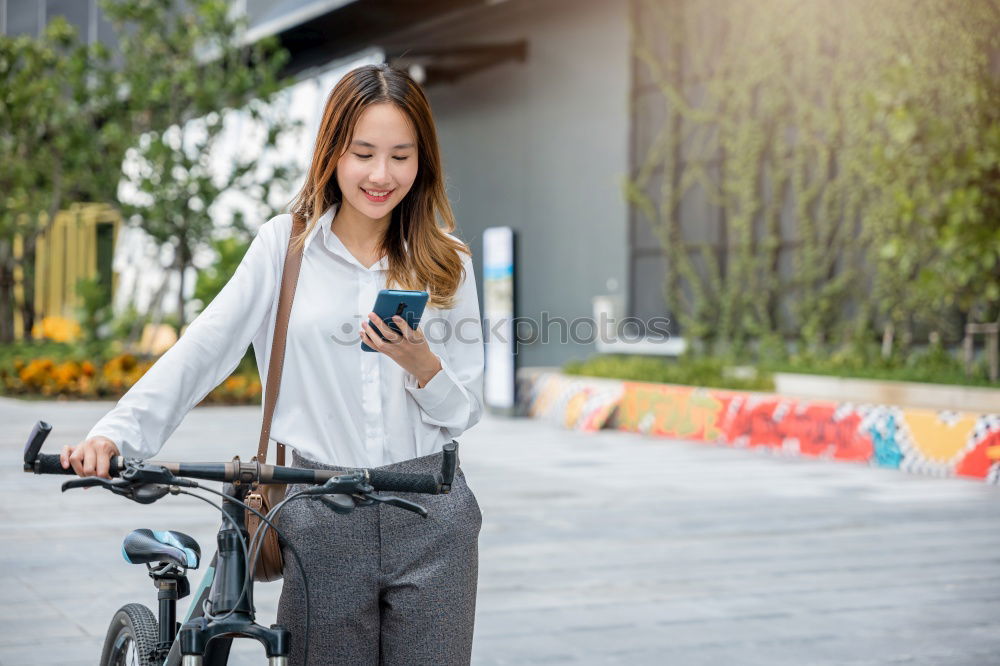 Image, Stock Photo Women with bikes browsing smartphone