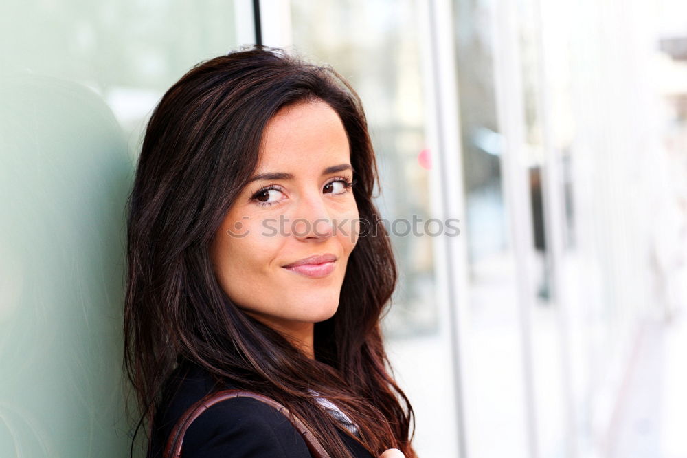 Similar – Young woman wearing casual clothes smiling in urban background