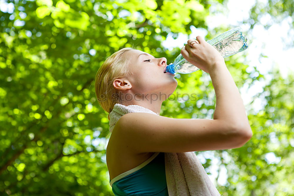 Similar – Young man drinking bottled water