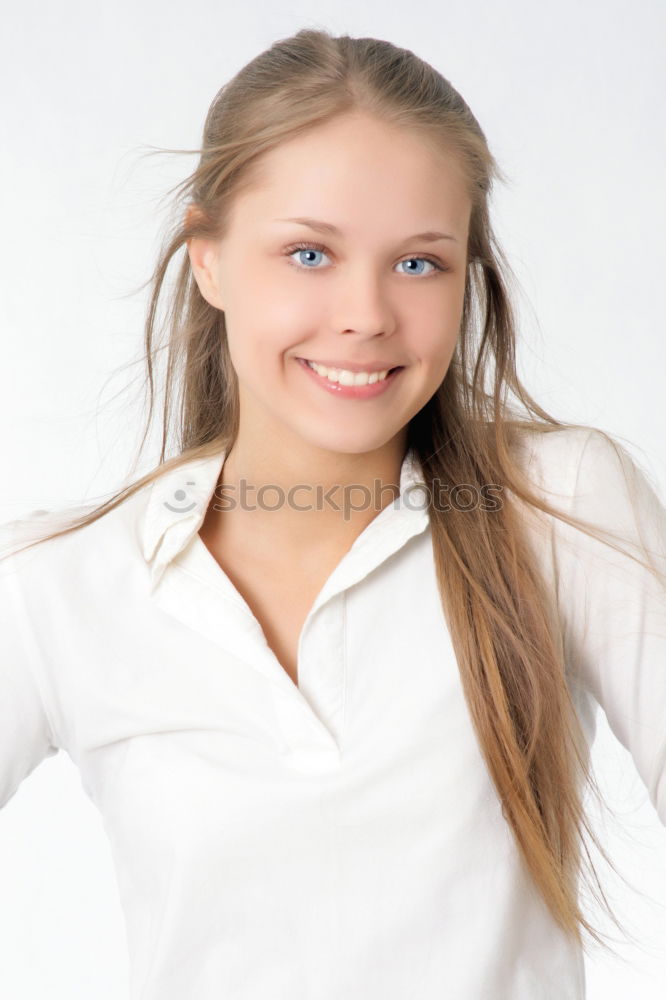 Similar – Young blonde woman smiling near a brick wall