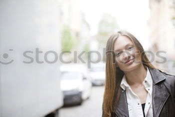 Similar – Woman standing on the street