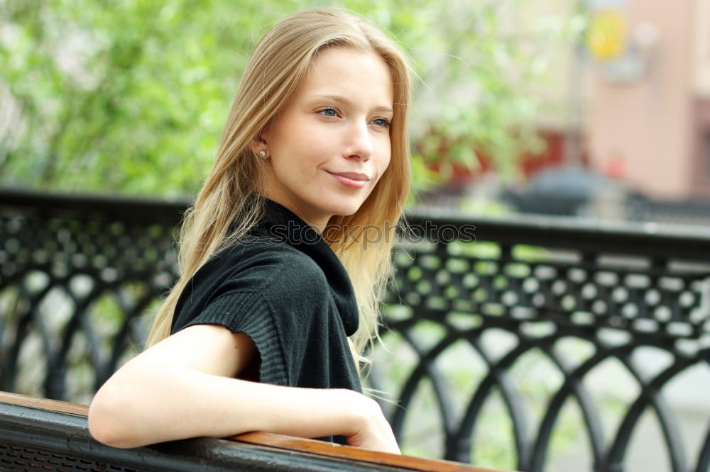 Similar – Young woman smiling in urban background.