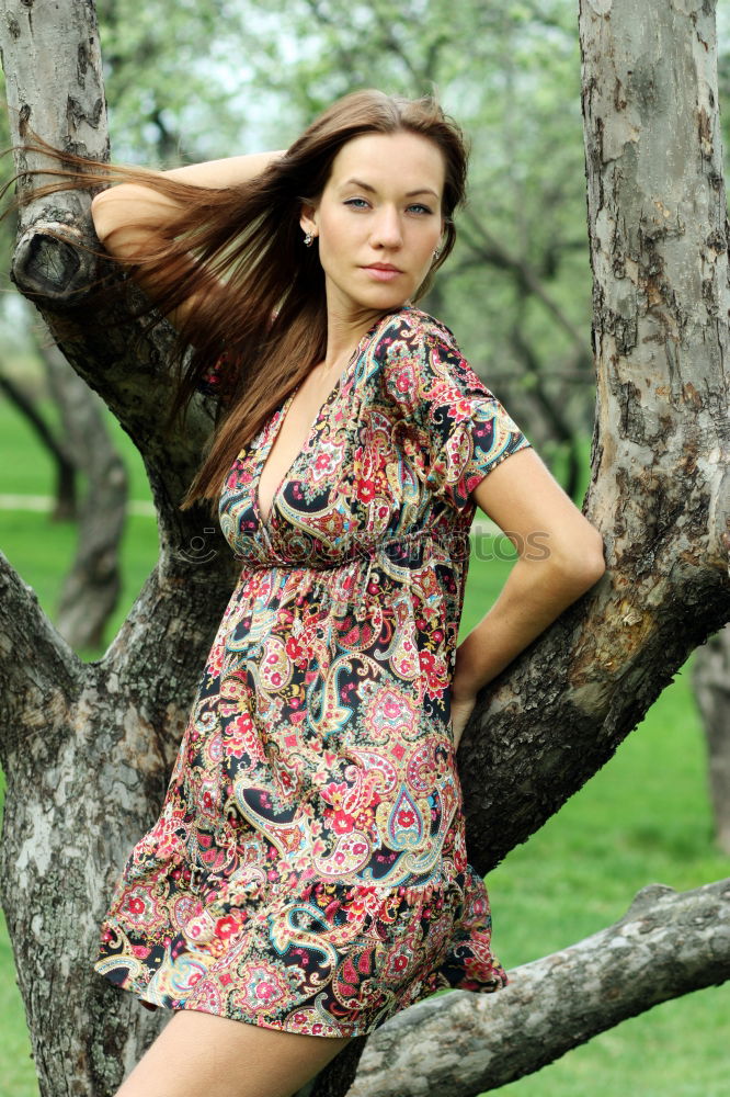 Similar – A young woman sitting on a garden bench