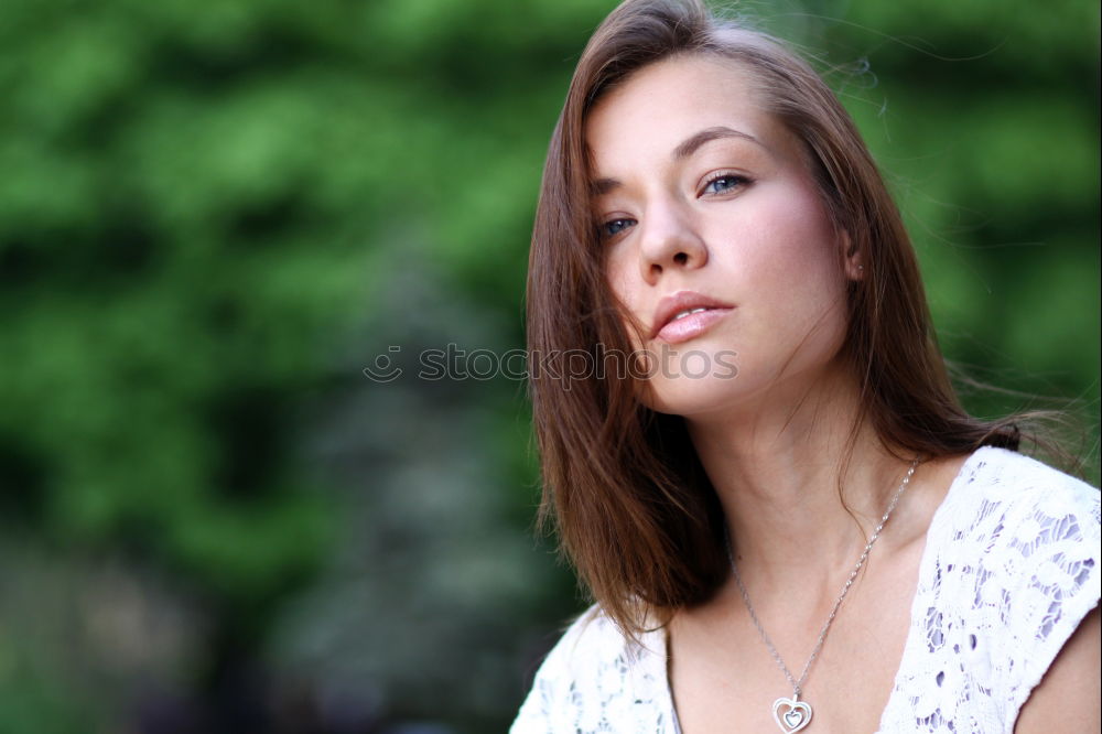 Similar – Beautiful brunette girl relaxing in the park