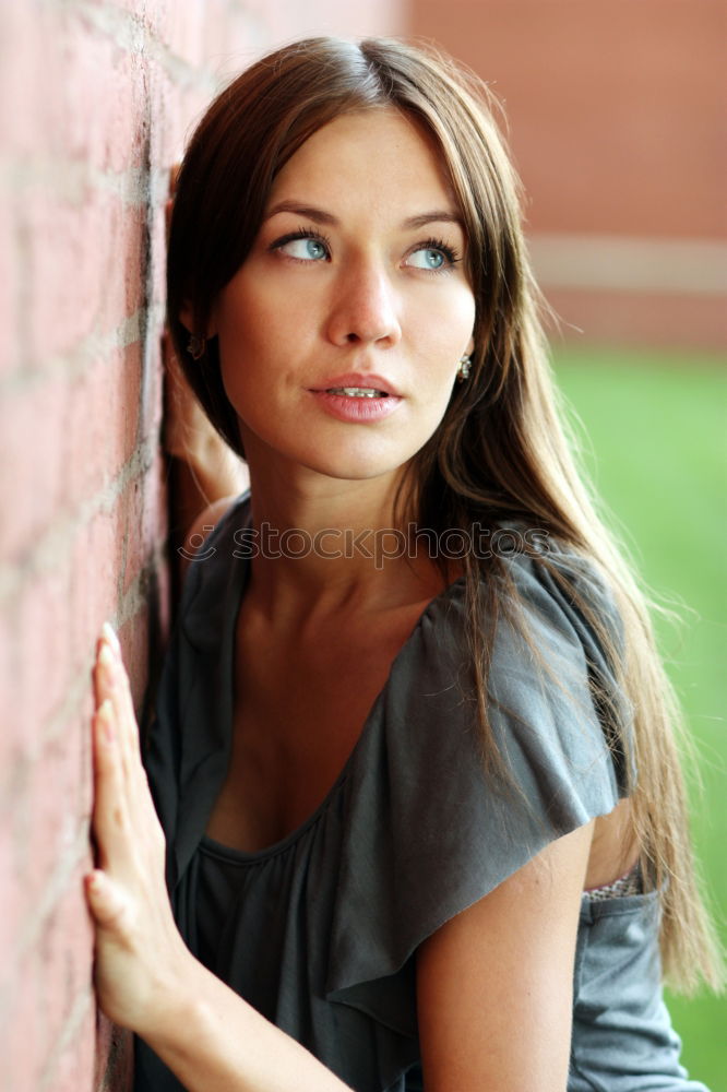 Similar – Girl with blue eyes smiling sitting on urban step