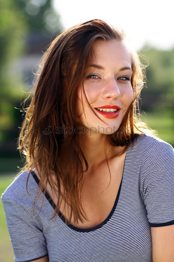 Similar – Young woman smiling in urban background