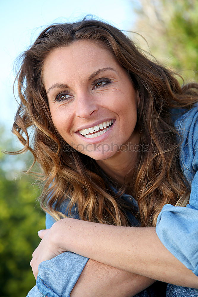 Similar – Young woman smiling in urban background