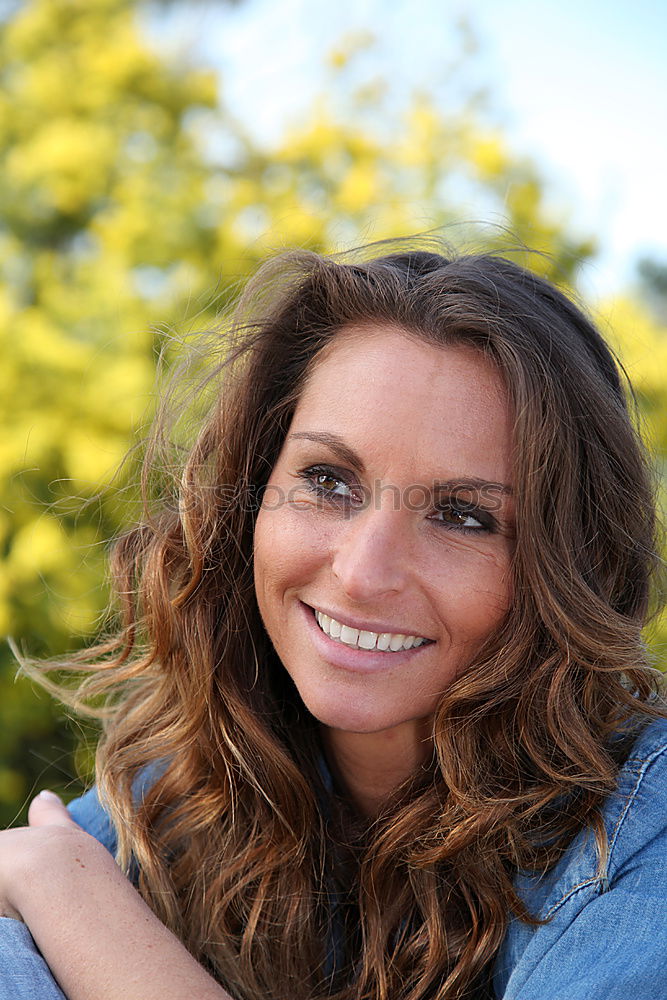 Similar – Young woman smiling in urban background