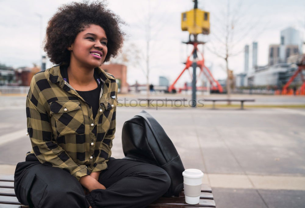 Similar – Image, Stock Photo Portrait of a cheerful young african woman standing outdoors