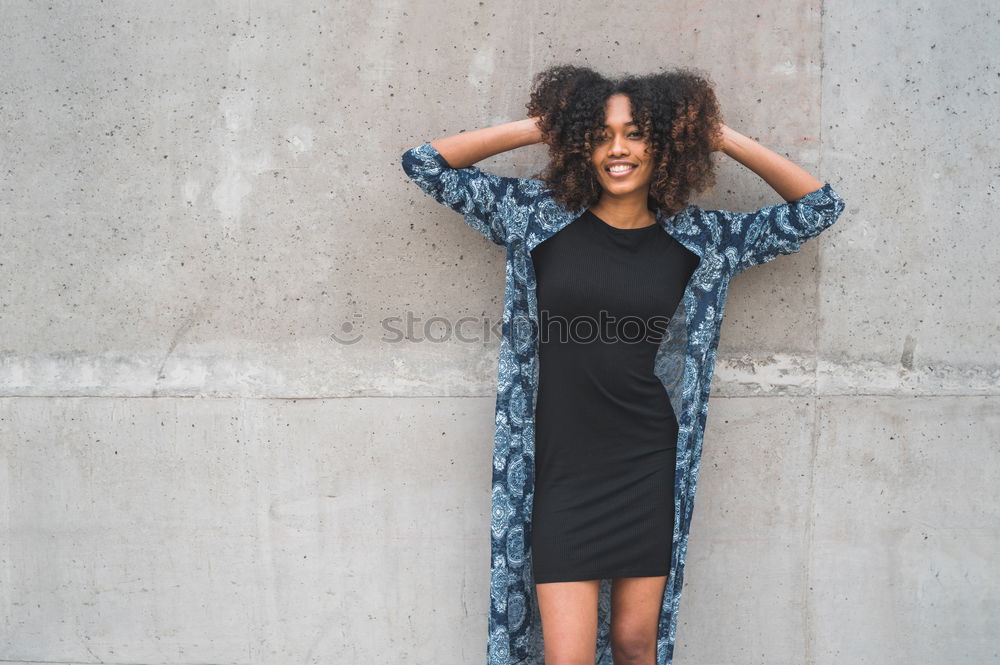 Similar – Portrait of smiling young african woman in greenhouse