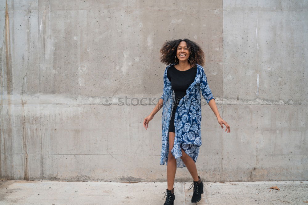 Similar – Woman with afro hair climbing by children’s attractions.