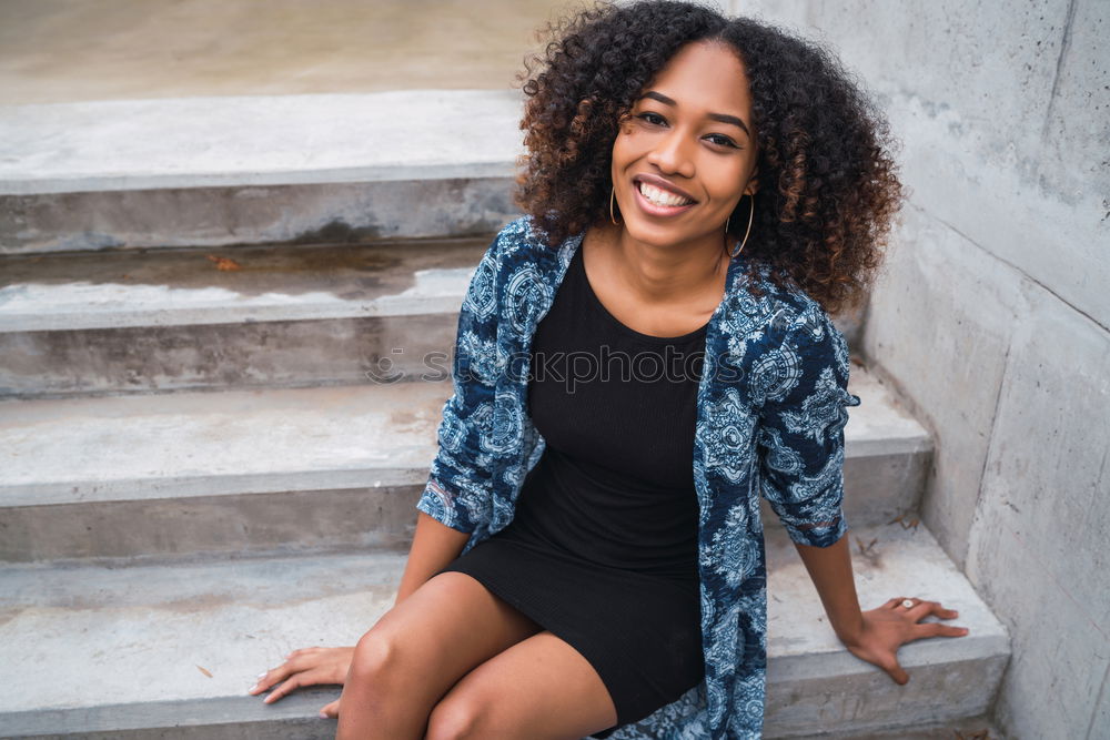 Similar – close up of a pretty black woman with curly hair smiling and lying on bed looking away