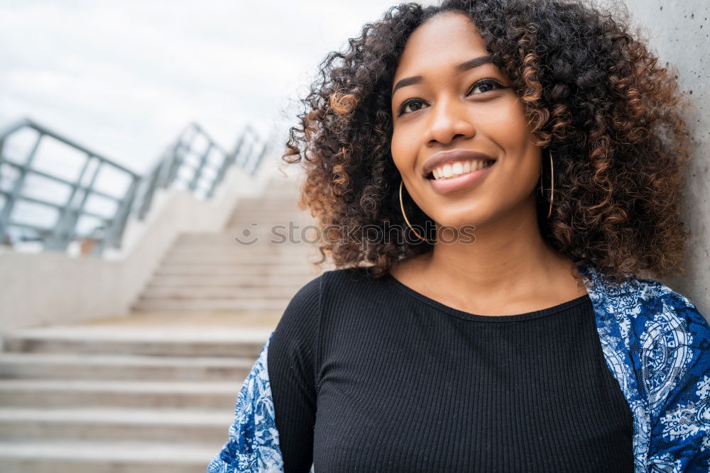 Similar – close up of a pretty black woman with curly hair smiling and lying on bed looking away