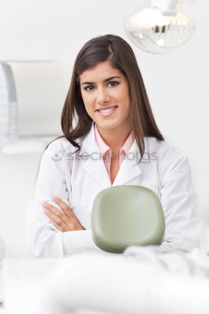 Similar – Female cosmetician applying a facial mask with special cosmetic brush. Beautiful cosmetician looking to the camera