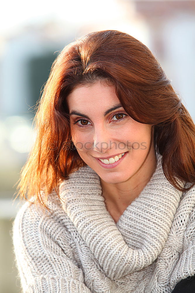 Attractive woman looking into store window