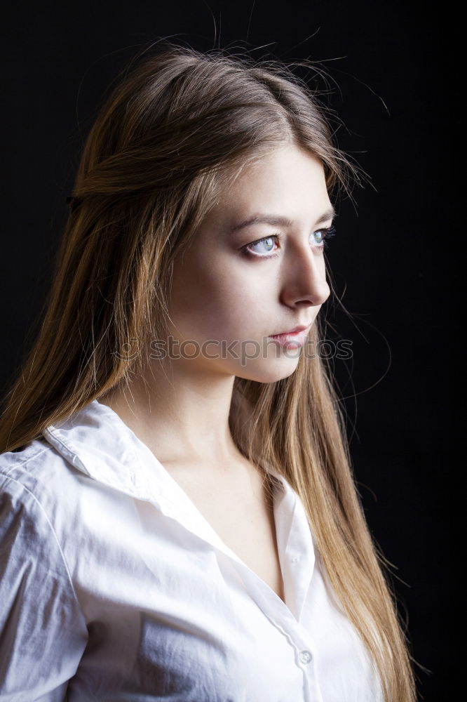 Similar – Portrait of a beautiful girl with big blue eyes looking at camera with surprised expression