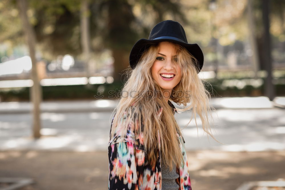 Image, Stock Photo Smiling blond woman with hat in urban background