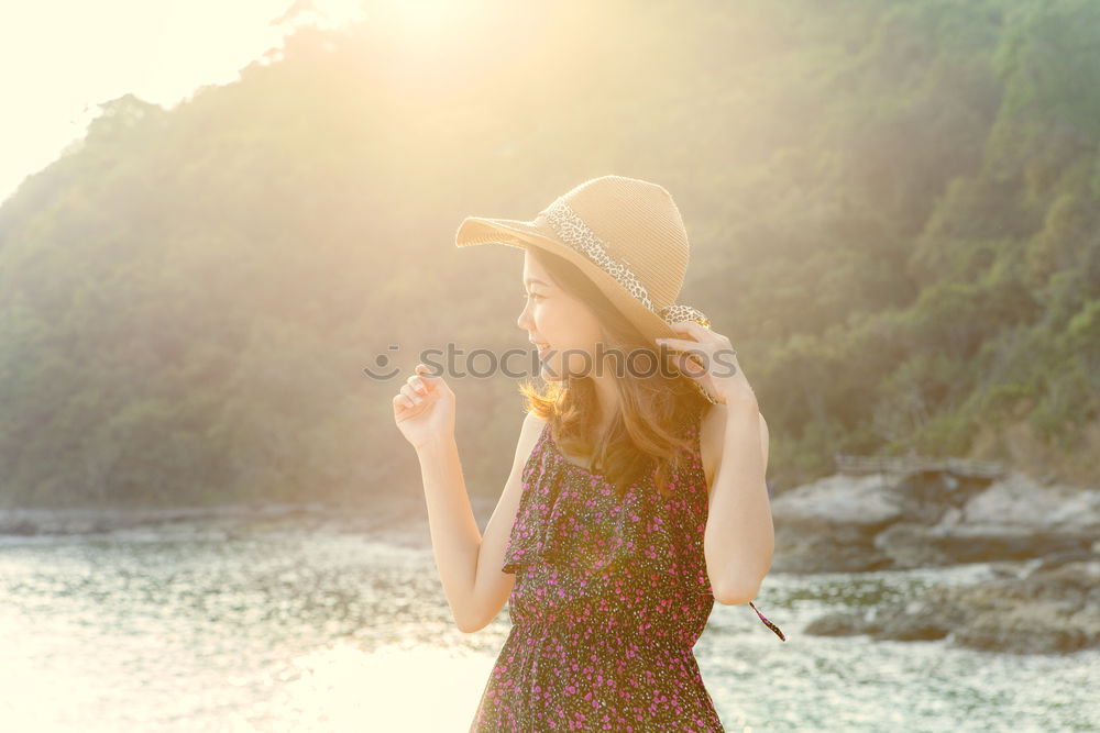 Similar – Smiling woman with sunglasses and hat raising arms happy with the sea in the background.