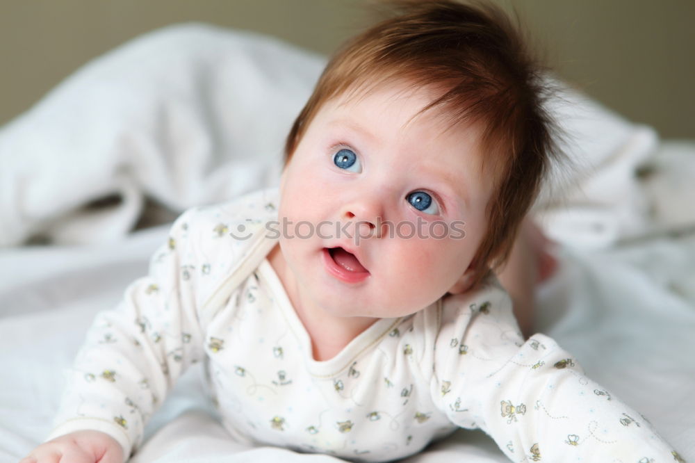 Similar – Image, Stock Photo Lovely newborn baby girl with a warm pajama at home