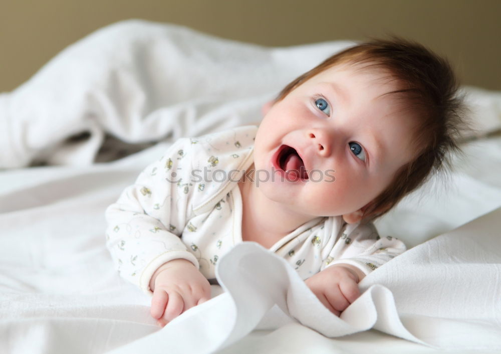 Similar – Little girl lying in a bed with teddy bear at the morning