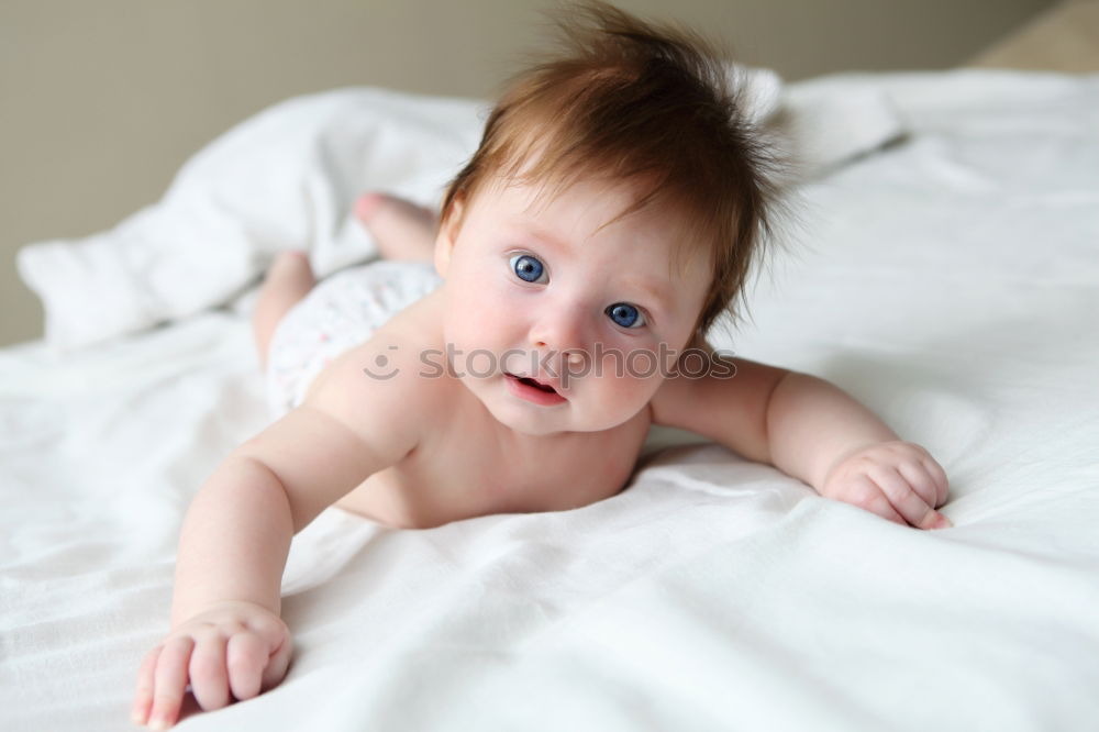 Similar – Cute Baby Girl Lying in the Crib.