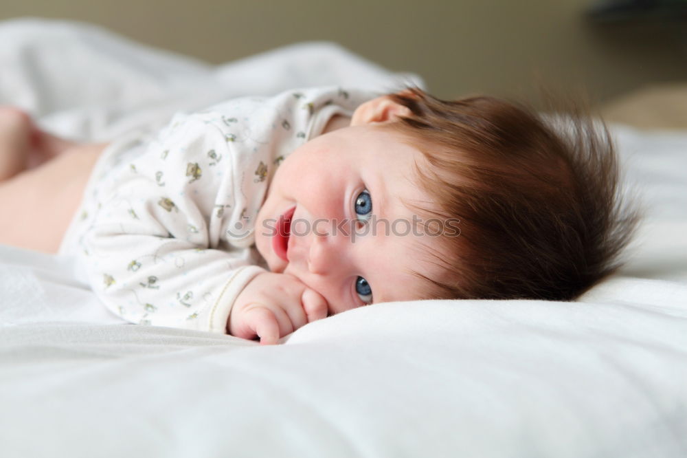 Similar – cute happy child girl relaxing at home on the bed