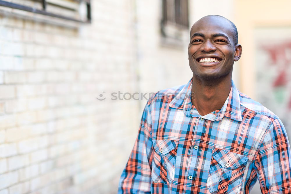 Similar – Image, Stock Photo Smiling black man with smartphone in his hand