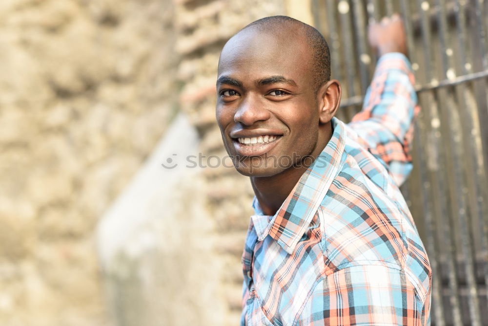 Image, Stock Photo Black man smiling and sitting in urban steps