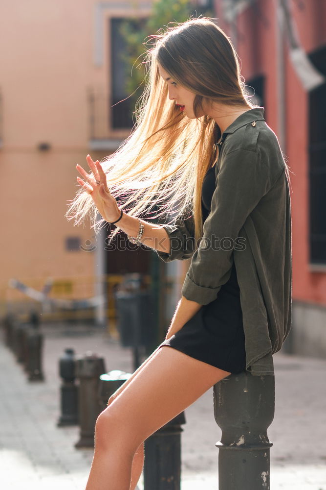 Similar – Happy female riding skate board in street