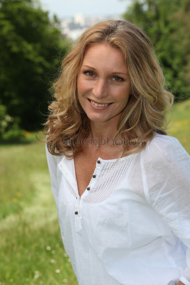 Similar – Middle Aged Woman Smiling Outdoors Portrait