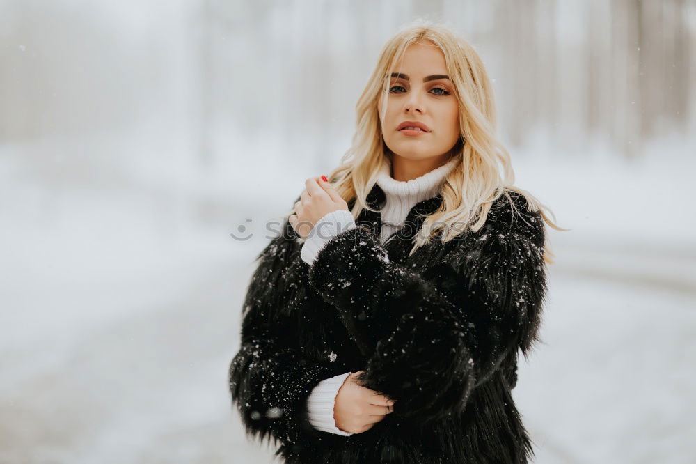 Similar – young woman 30 years in snow with red coat and leopard dress blond hair curly happy hopeful street