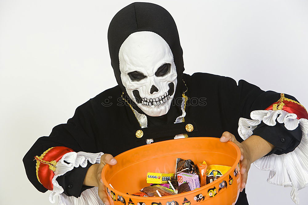 Similar – Image, Stock Photo Happy children disguised decorating a pumpkin at home.