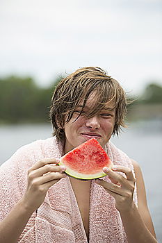 Similar – Not so young but happy Caucasian woman chewing watermelon