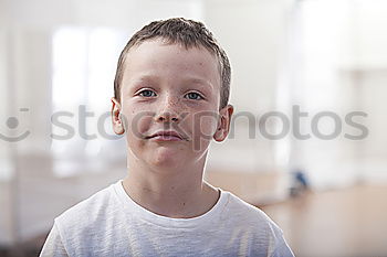 Similar – Image, Stock Photo Portrait of a young student leaning on wall while looking camera