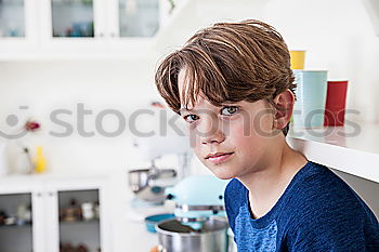 Similar – Image, Stock Photo Portrait of a young student leaning on wall while looking camera