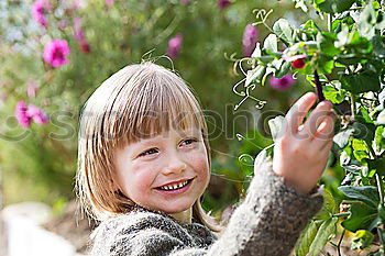 Similar – Image, Stock Photo Little baby is touching fresh spring leaves in her mother’s hug