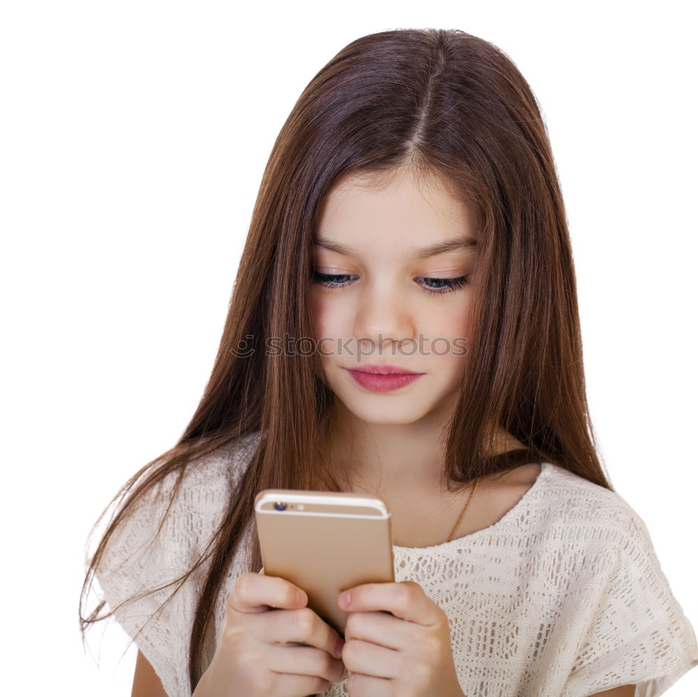 Similar – portrait of a beautiful kid using mobile phone