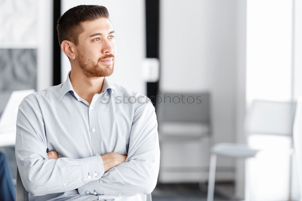 Similar – Bearded man in sunglasses looking at the window