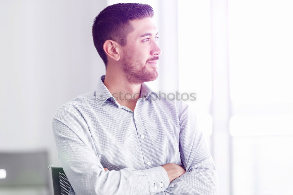 Similar – Bearded man in sunglasses looking at the window