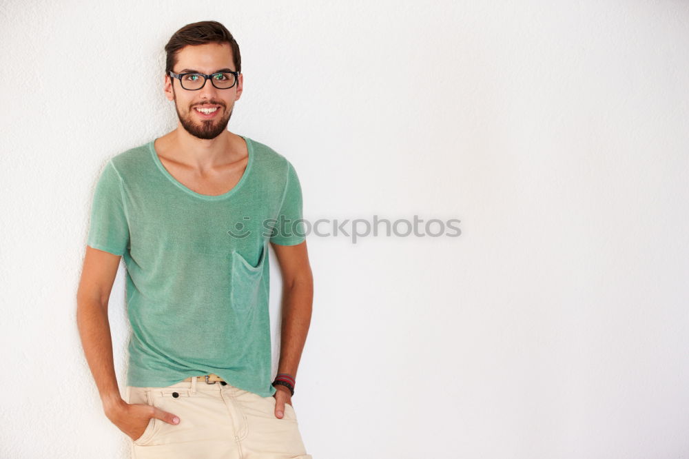 Similar – young handsome man with t-shirt against a wall in street