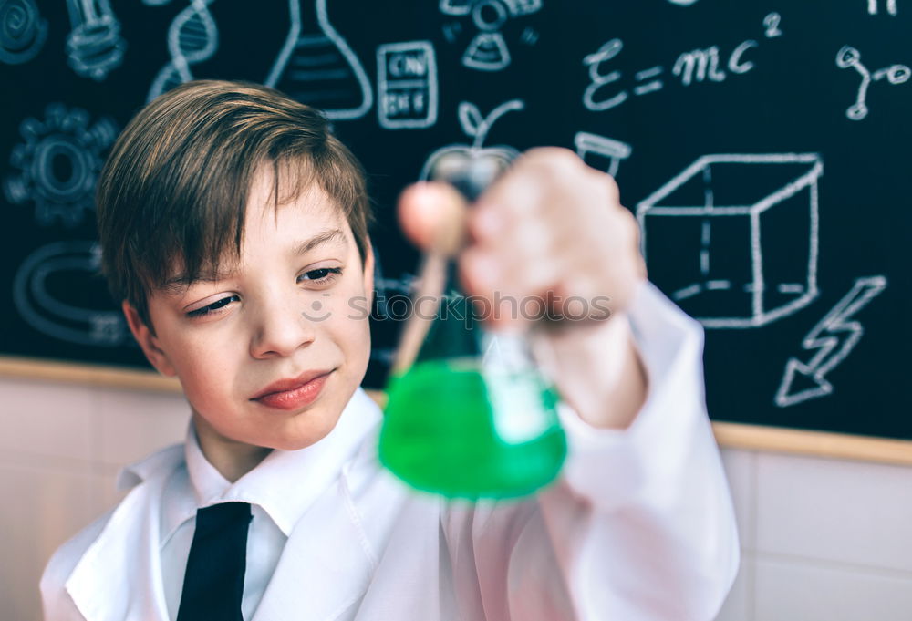 Similar – Image, Stock Photo Boy playing with chemistry game