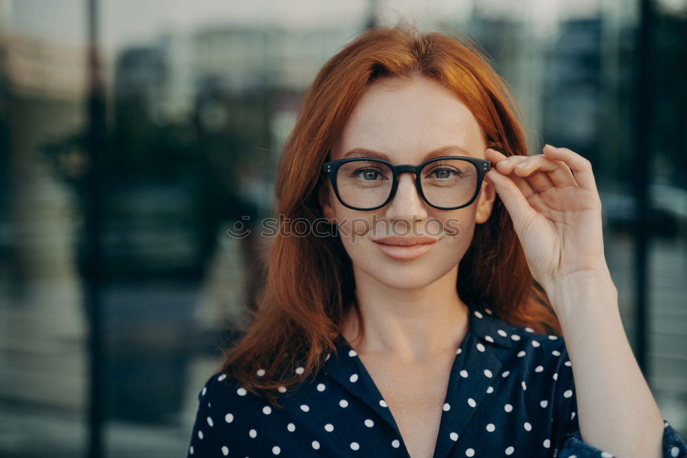 Similar – Elegant woman standing against dark background