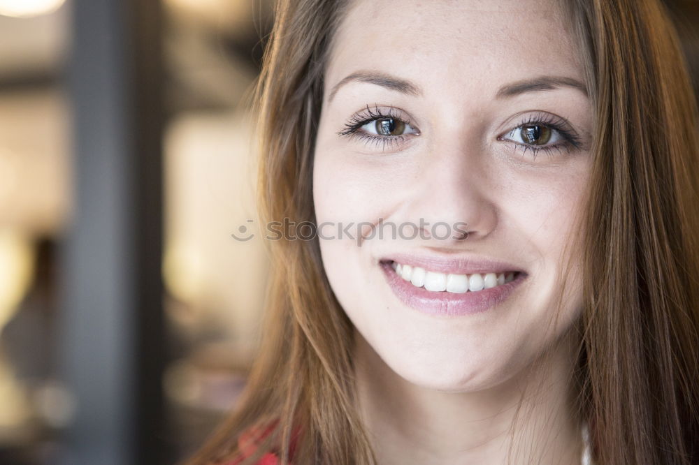 Similar – Close portrait of beautiful young woman with green eyes smiling at camera