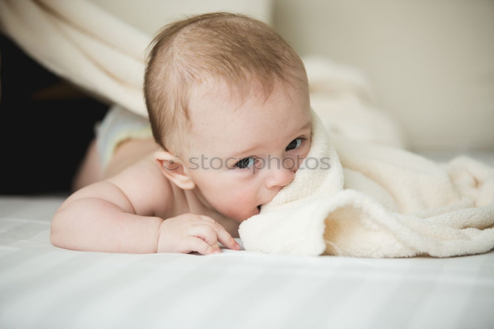 Similar – Person touching hand of baby