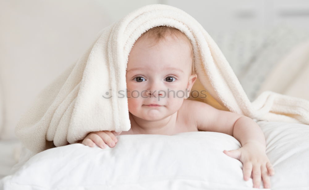 Similar – The back of a baby’s head lying on its stomach