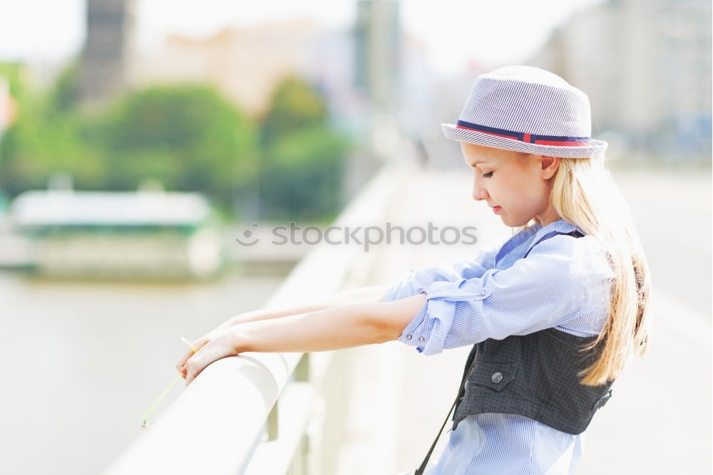 Similar – Image, Stock Photo Young girl sitting on jetty over the lake and dipping feet in water on sunny day in the summertime