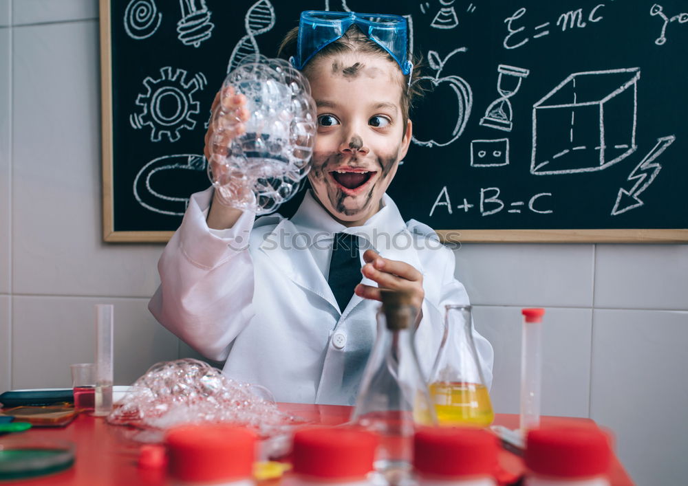 Similar – Child dressed as a scientist and chalkboard