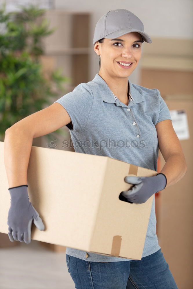 Similar – Man carrying moving boxes