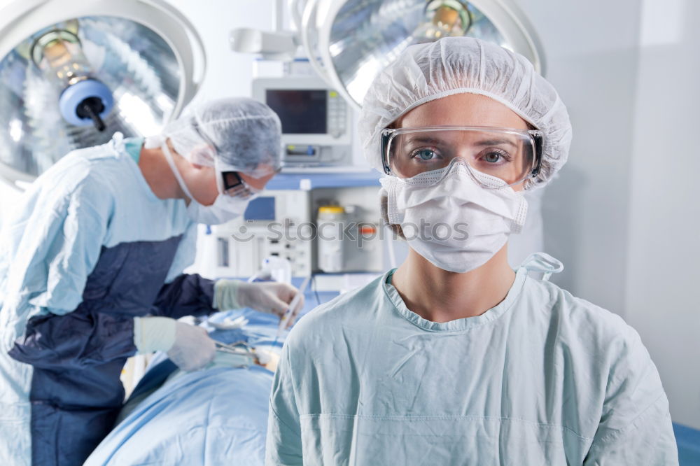 Similar – Image, Stock Photo Team of Surgeons Operating.